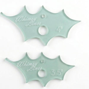 A close up of two holly leaf acrylic templates 
