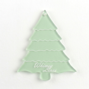 A close up of an acrylic sewing and craft Christmas tree