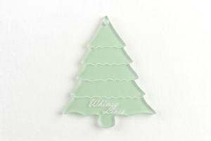 A close up of an acrylic sewing and craft Christmas tree