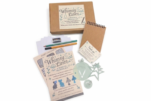 Whimsy Lines Spring Mindful Drawing Kit for adults featuring acrylic templates, sketchbook, fine liner pen, and pencil in a gift box.
