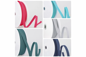 A bundle of skinny 2mm polycotton flanged piping trim showing the narrow cord and insertion flange.