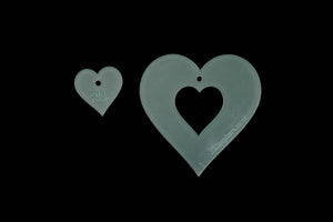 A SET OF ACRYLIC HEARTS, DIAMONDS, SPADES AND CUBS TEMPLATES