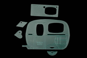 Caravan-shaped acrylic sewing template for patchwork, quilting, and fabric appliqué, featuring a classic retro camper design.